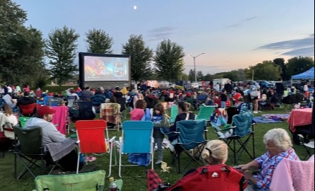 Crowd of people watching outdoor movie