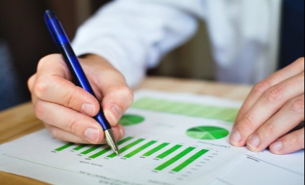 Man analyzing green charts