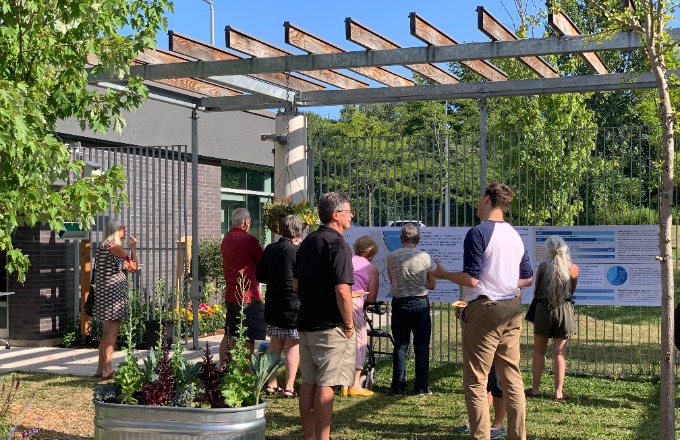 People providing feedback in outdoor pop-up space