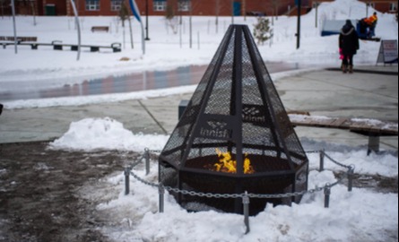 Fire pit with Innisfil logo on fire screen