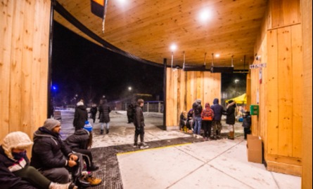 Covered space with heating lamps and benches