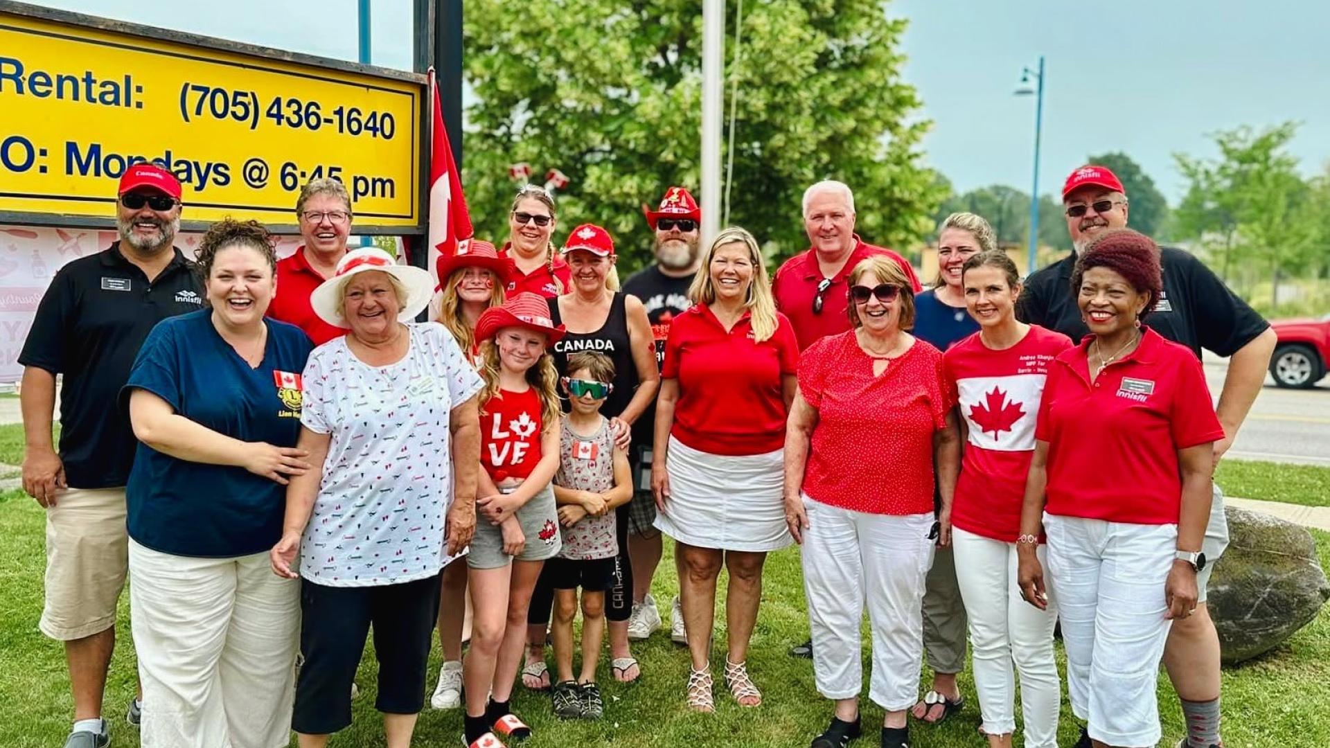 Council and community members posing for group photo at Lions Club Canada Day event