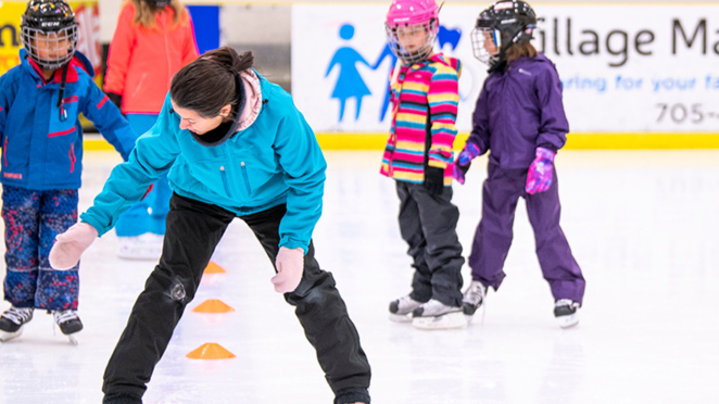 People ice skating in an arena