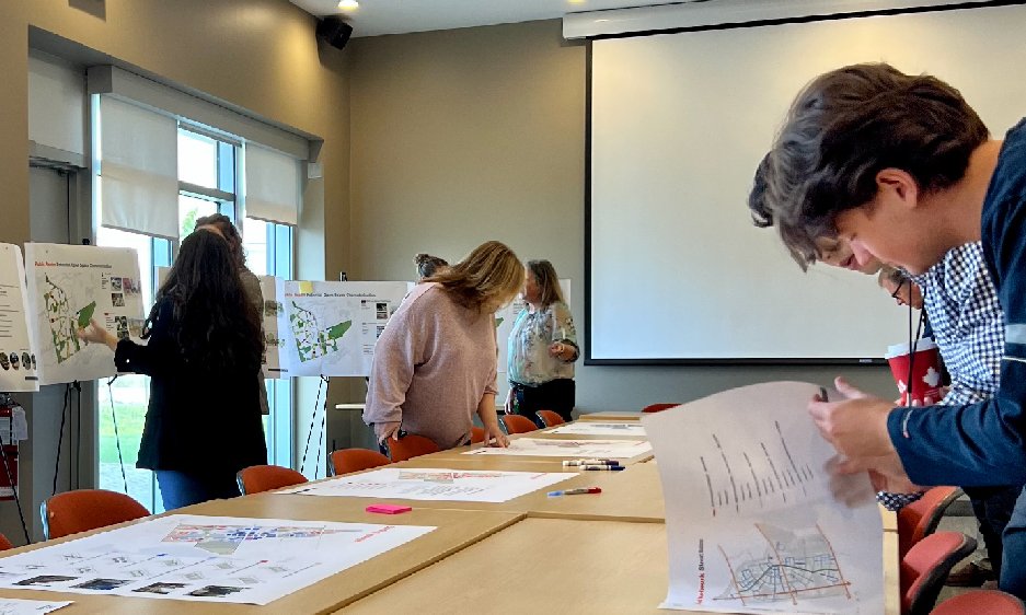 People looking at presentation boards