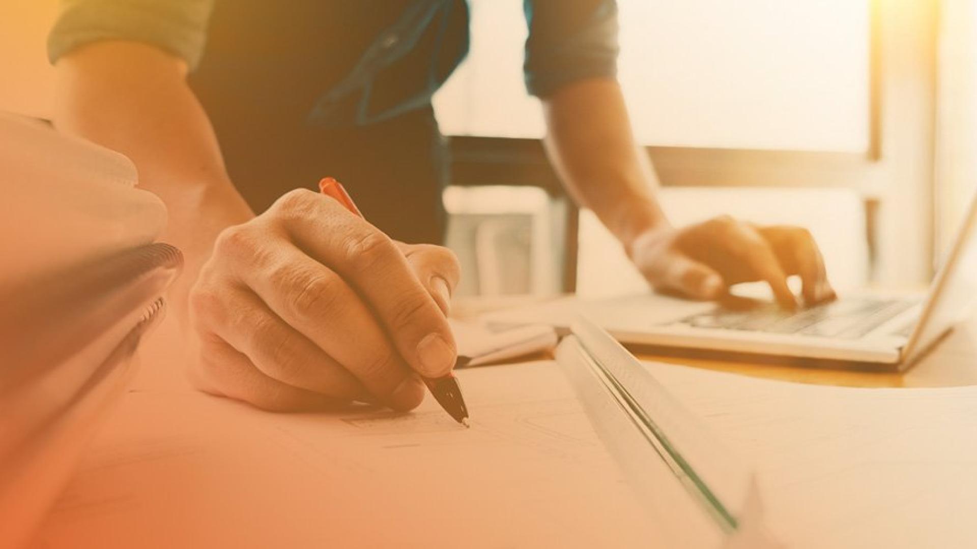Architect & Engineer working drawing document about project planning and progress of work schedule on the home building construction site.