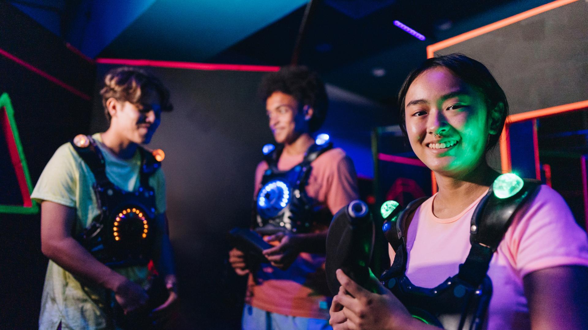  Portrait of a teenager girl playing laser tag