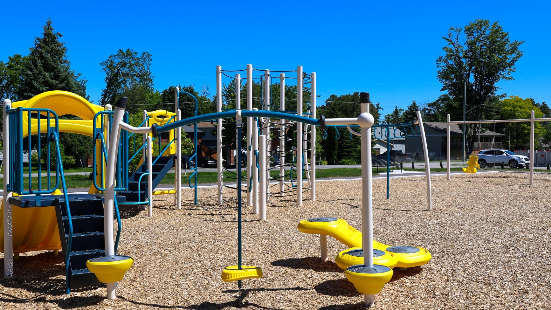 New playground equipment at Nantyr Park with swings, slides, and climbing features