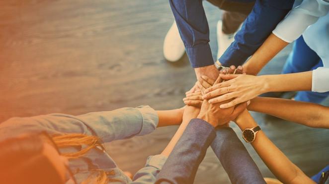 Group of people with hands in