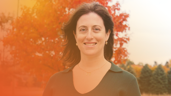 employee standing outside smiling