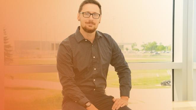 Town employee with Innisfil Recreation Complex in the background