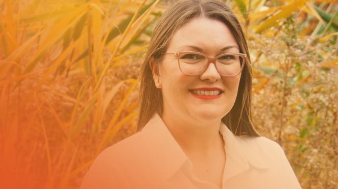 employee standing outside smiling