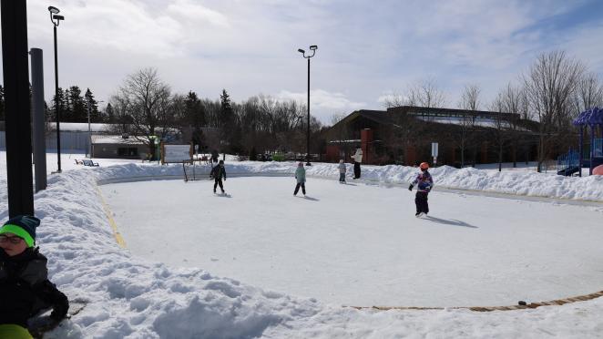 Children skating on an outdoor skating rink