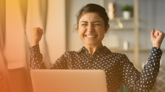 Happy young woman with laptop