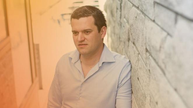 Man looking away in staircase