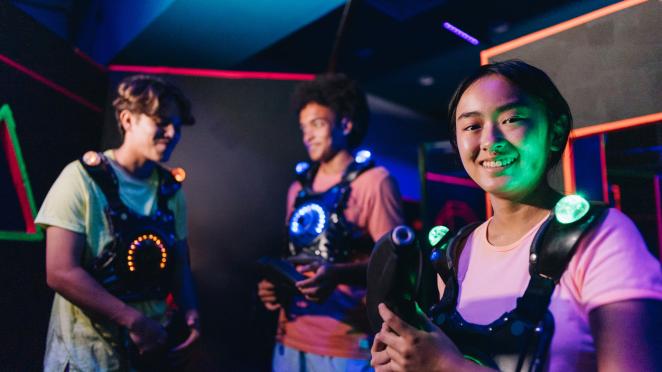  Portrait of a teenager girl playing laser tag