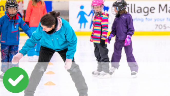 People ice skating in an arena