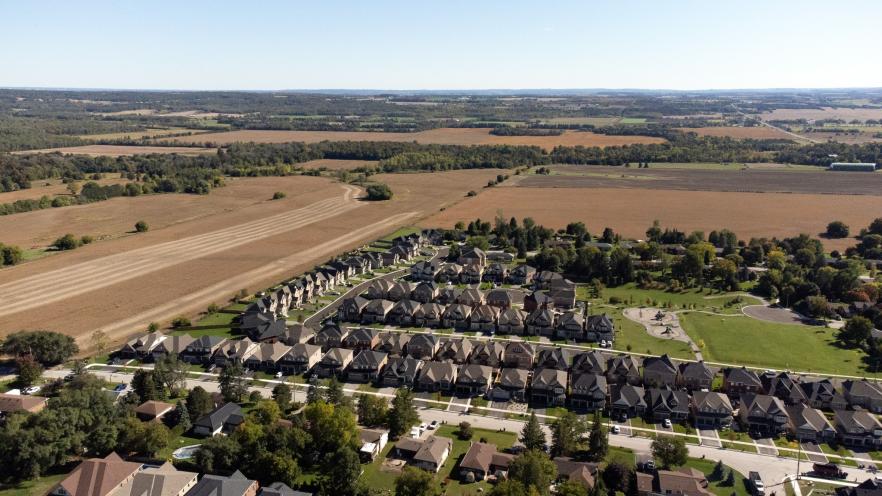 Aerial view of farmland and housing development