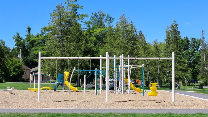 New playground equipment at Nantyr Park with swings, slides, and climbing features