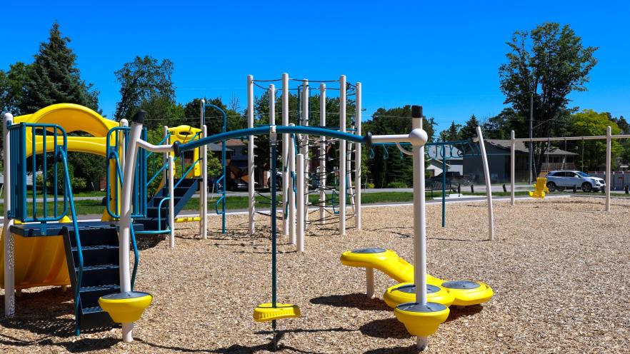 New playground equipment at Nantyr Park with swings, slides, and climbing features