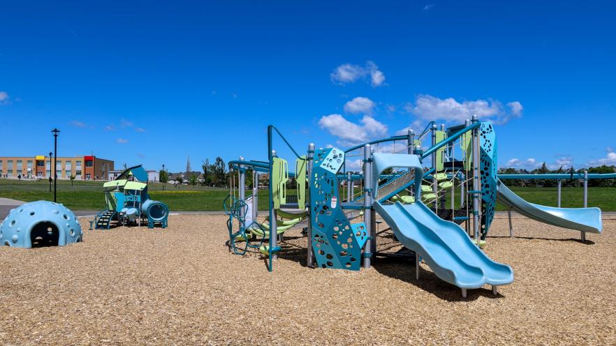 Vibrant new playground equipment at Previn Court Park with slides and climbing features