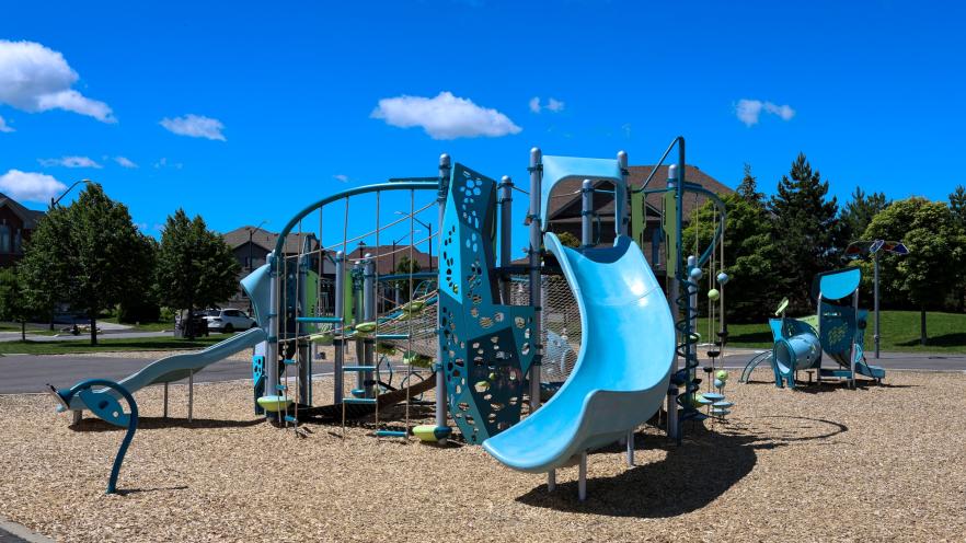 Vibrant new playground equipment at Previn Court Park with slides and climbing features