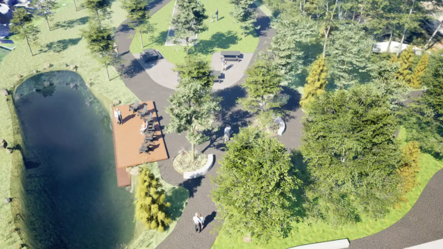 Aerial view of a park with a pond