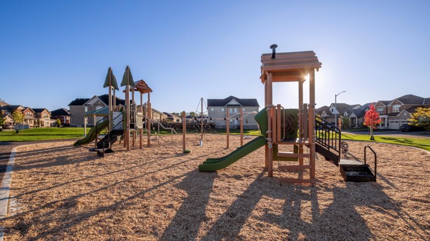 Big and little kids playground equipment at new park