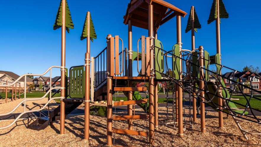 Tree fort-styled playground equipment at new outdoor park