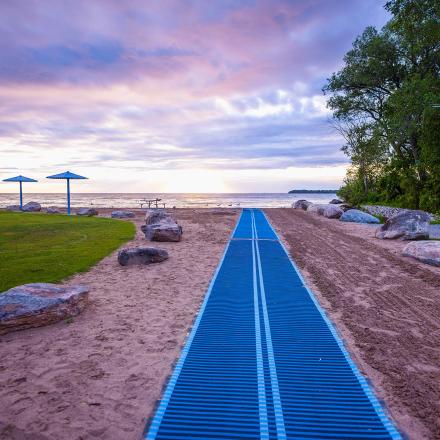 Beach wheelchair mat providing access to water