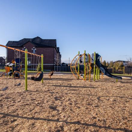 New playground equipment and swings with trail connections