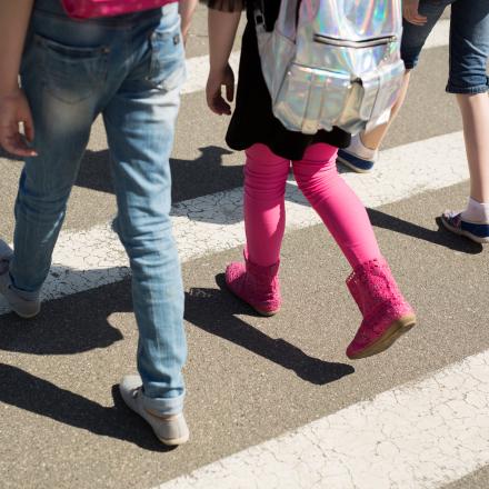 Schoolchildren crossing the road on their way to school