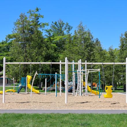 New playground equipment at Nantyr Park with swings, slides, and climbing features