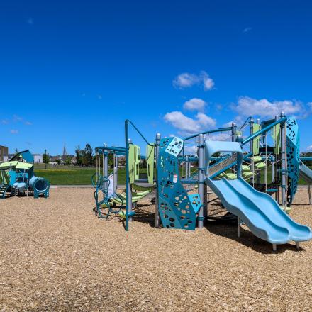 Vibrant new playground equipment at Previn Court Park with slides and climbing features