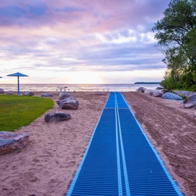 Accessible beach mat leading the way to the lake
