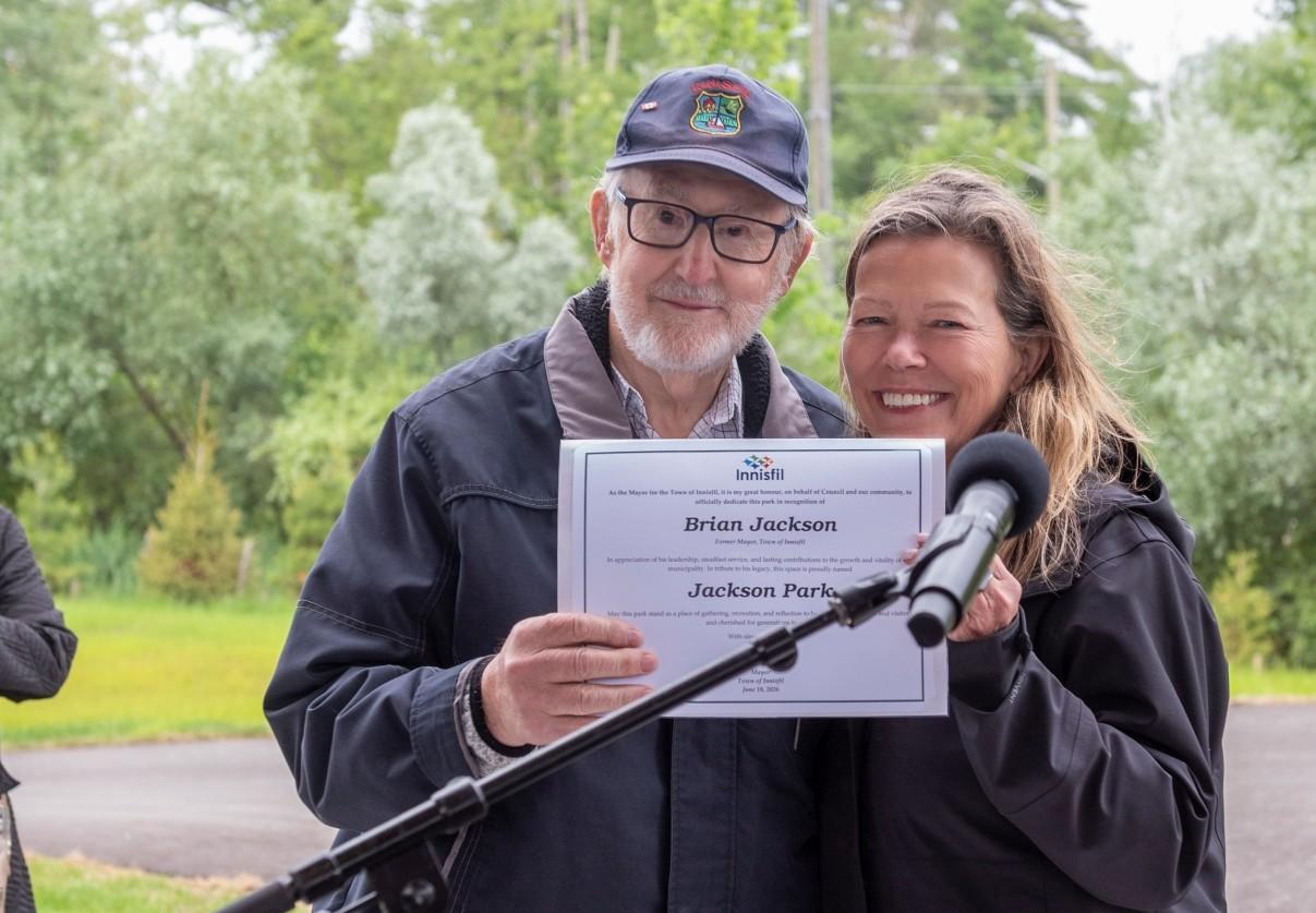 Mayor Jackson and Mayor Dollin holding a certificate in honour of Jackson Park grand opening